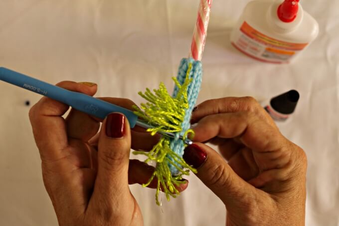 attaching the mane to the horse's body with a crochet hook